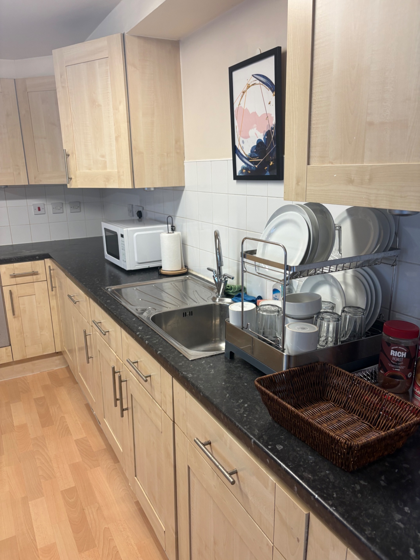 Freshly cleaned kitchen worktops and sink after a turnover clean